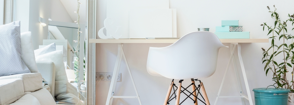 Panorama of contemporary study area with simple wooden desk