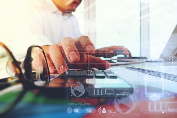 business documents on office table with laptop computer and graph business digital diagram and businessman working in the background