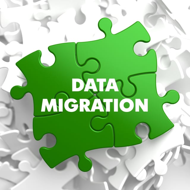 Data Migration on Green  Puzzle on White Background..jpeg