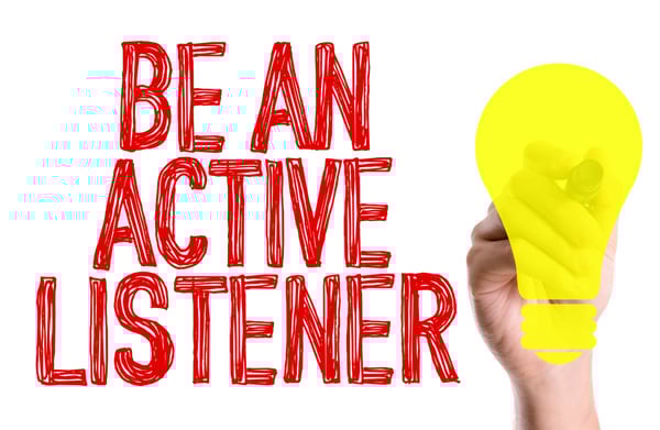 Hand with marker writing the text Be An Active Listener