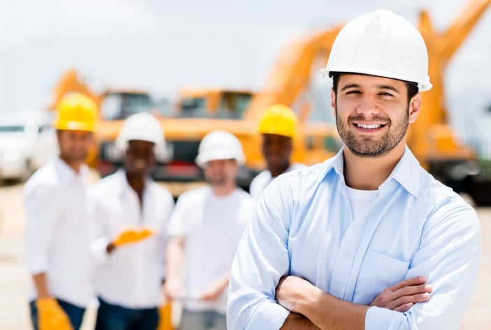 Successful male architect at a building site with arms crossed .jpeg