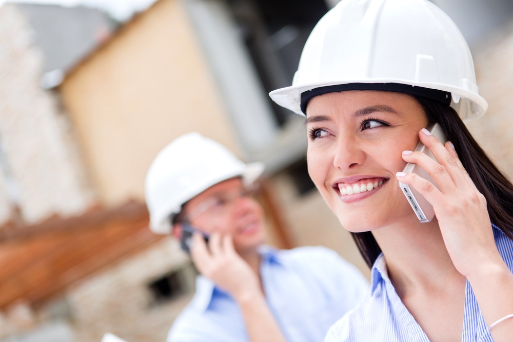 Architects talking on the phone at a building site.jpeg